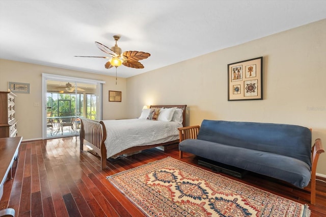 bedroom featuring ceiling fan, dark hardwood / wood-style flooring, and access to outside