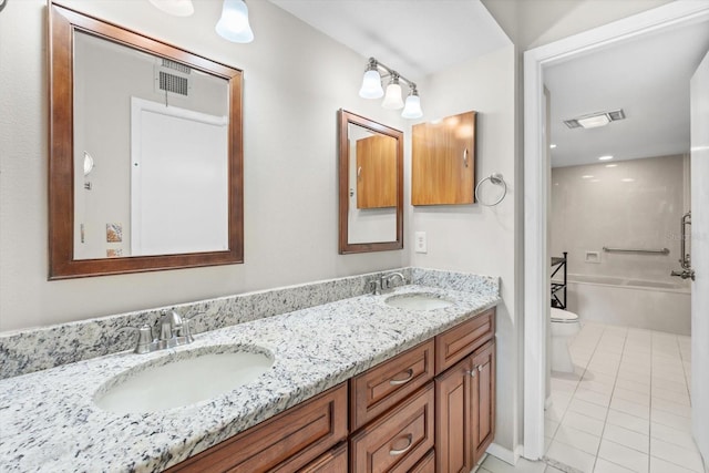 full bathroom featuring vanity, toilet, tub / shower combination, and tile patterned flooring