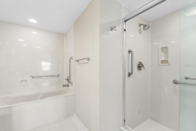 bathroom featuring a shower with door and tile patterned flooring