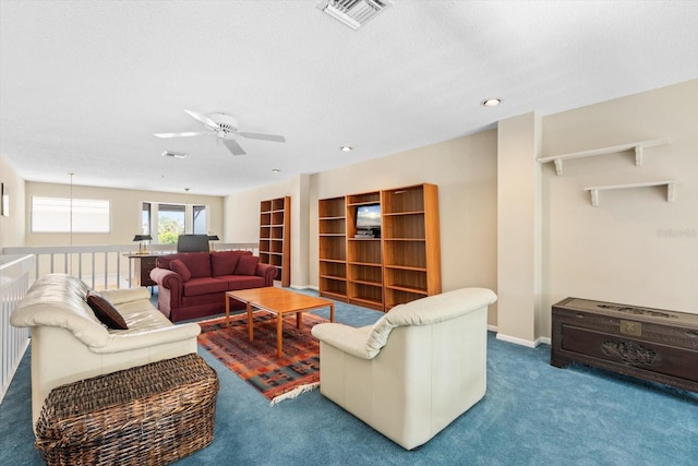 living room with carpet floors and a textured ceiling