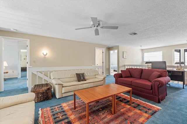 living room with carpet and a textured ceiling