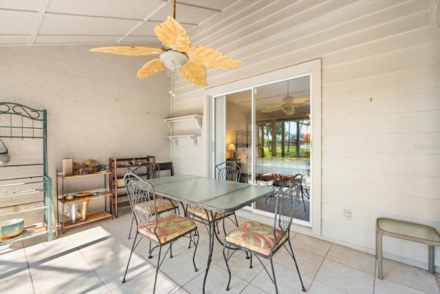 dining space featuring light tile patterned floors and ceiling fan