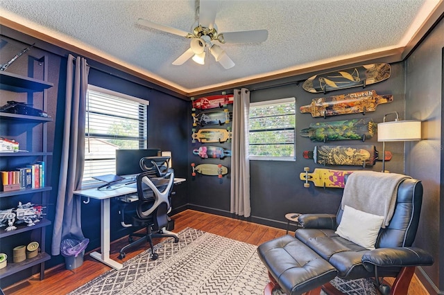 office featuring wood-type flooring, ceiling fan, and a textured ceiling