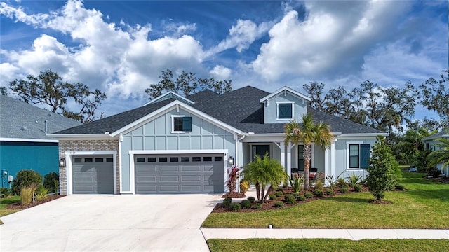 view of front of property with a garage and a front lawn