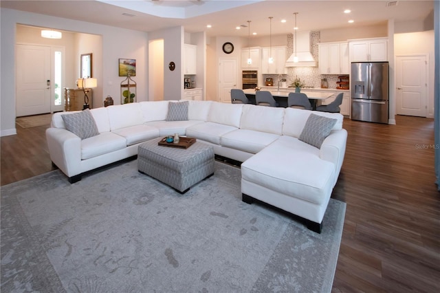 living room with dark hardwood / wood-style flooring