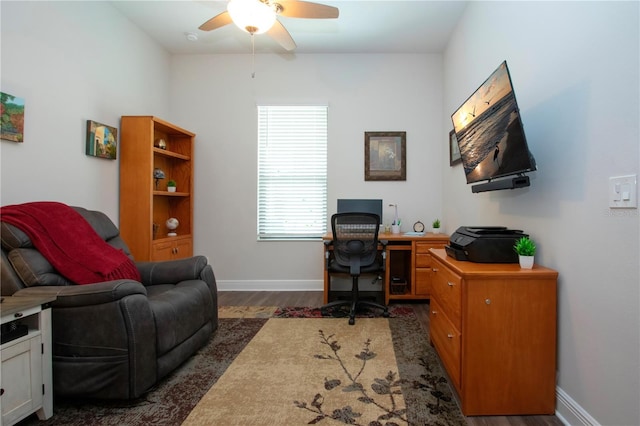 office featuring dark hardwood / wood-style flooring and ceiling fan