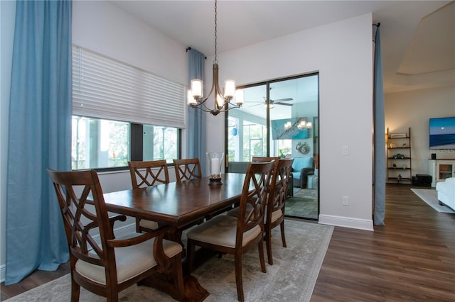 dining space featuring dark hardwood / wood-style floors and a notable chandelier