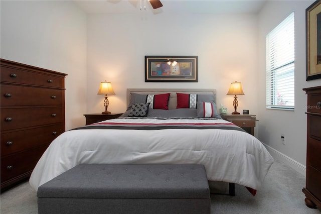 carpeted bedroom featuring ceiling fan