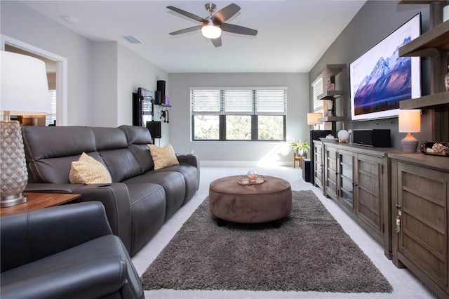 living room with light carpet and ceiling fan