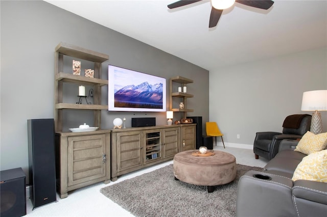 living room with light colored carpet and ceiling fan