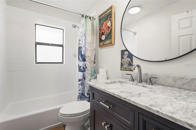 full bathroom with vanity, shower / bath combination with curtain, and toilet