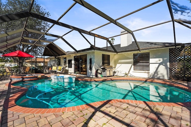 view of pool featuring an in ground hot tub, a lanai, and a patio area