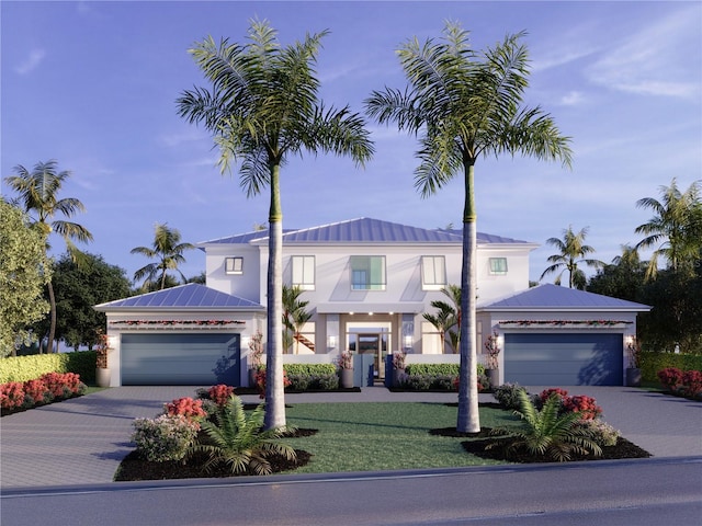 view of front facade featuring a garage and a front lawn