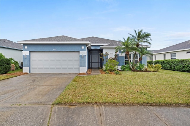 ranch-style house with a garage and a front yard