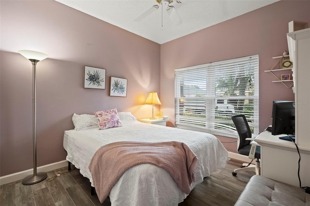 bedroom featuring dark wood-type flooring and ceiling fan