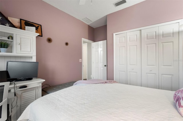 bedroom featuring ceiling fan and a closet