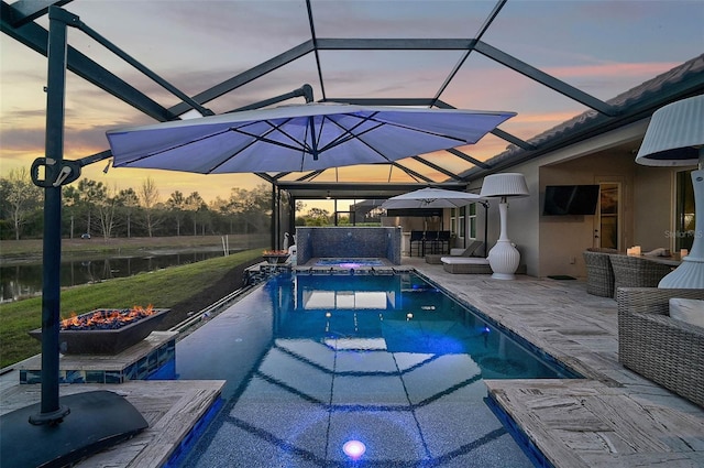 pool with a lanai, a patio area, outdoor dry bar, and an outdoor living space with a fire pit