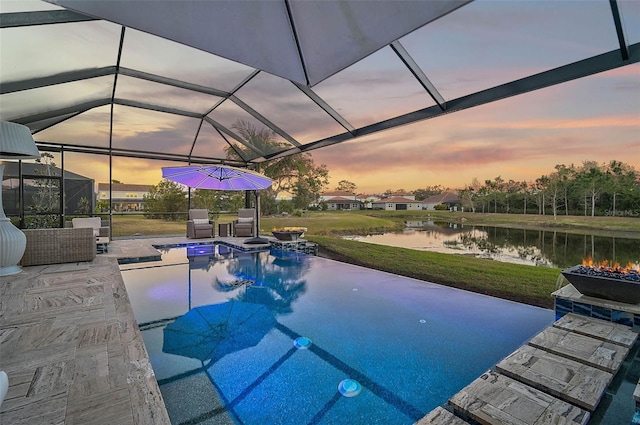 view of swimming pool featuring a patio, a water view, and a lanai