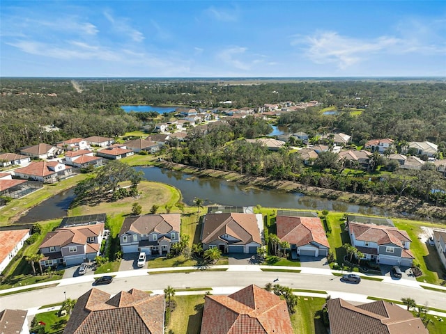 bird's eye view featuring a residential view and a water view