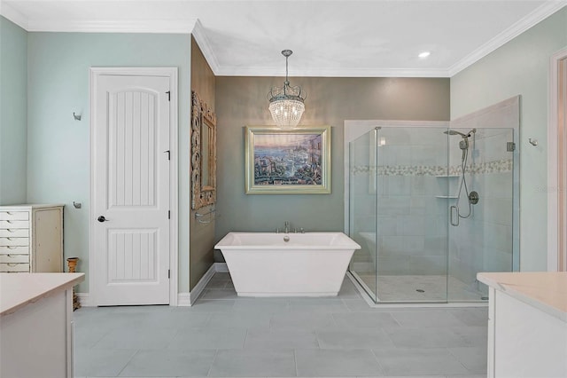 bathroom featuring ornamental molding, a stall shower, vanity, a freestanding tub, and baseboards