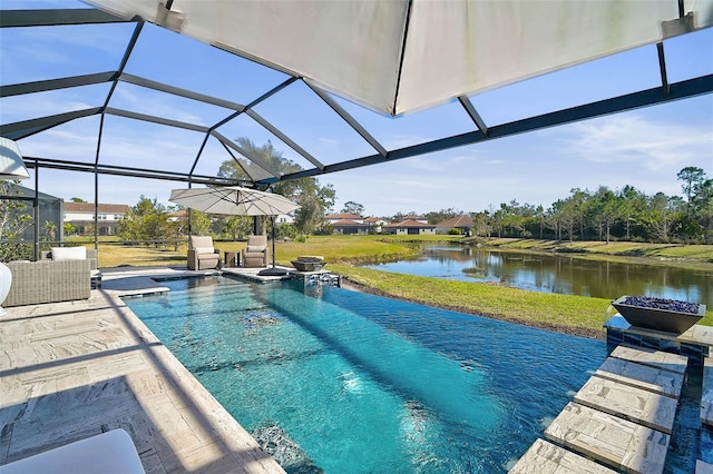 view of pool with a patio area, a yard, a water view, and a lanai