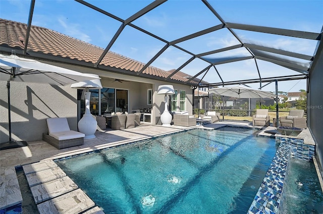 pool featuring a ceiling fan, glass enclosure, a patio area, and an outdoor living space