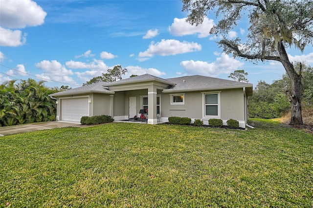 view of front of house with a garage and a front lawn