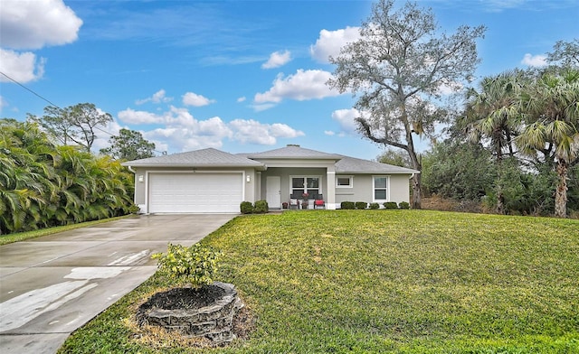 view of front of home with a garage and a front yard