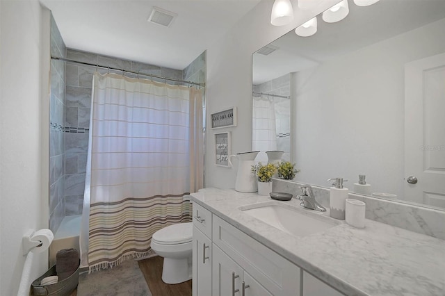 full bathroom featuring vanity, shower / bath combination with curtain, and toilet