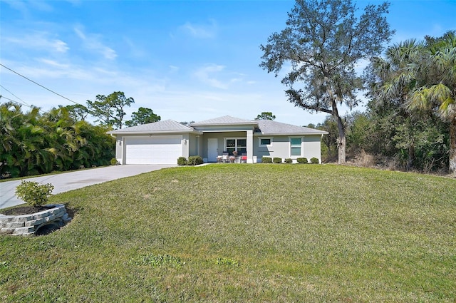 view of front of house with a garage and a front lawn