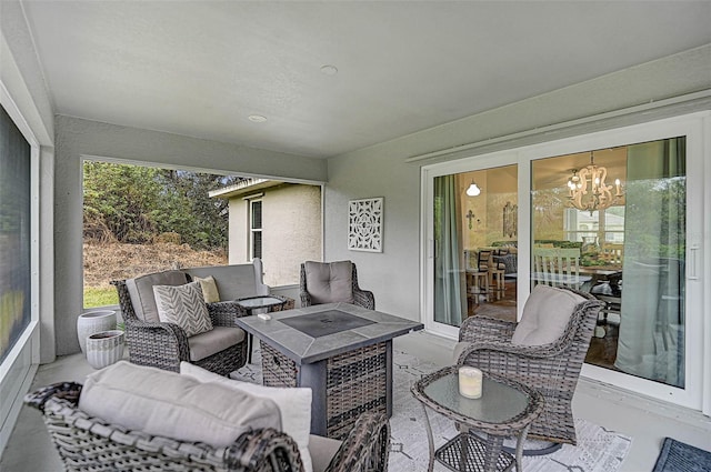 view of patio featuring an outdoor living space with a fire pit