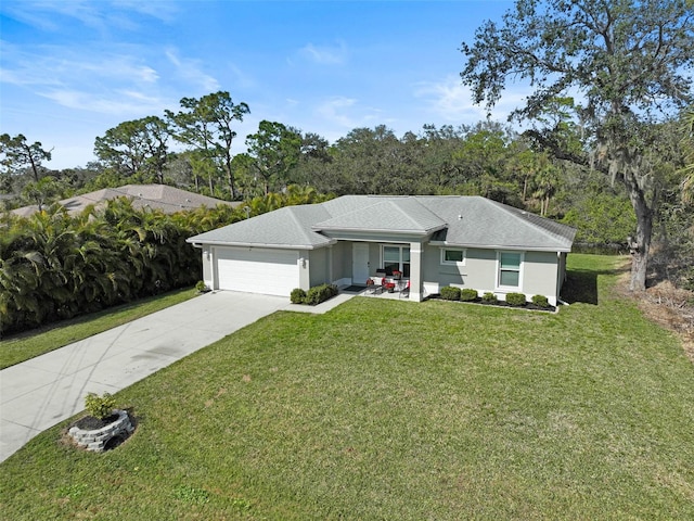 ranch-style home featuring a garage and a front yard