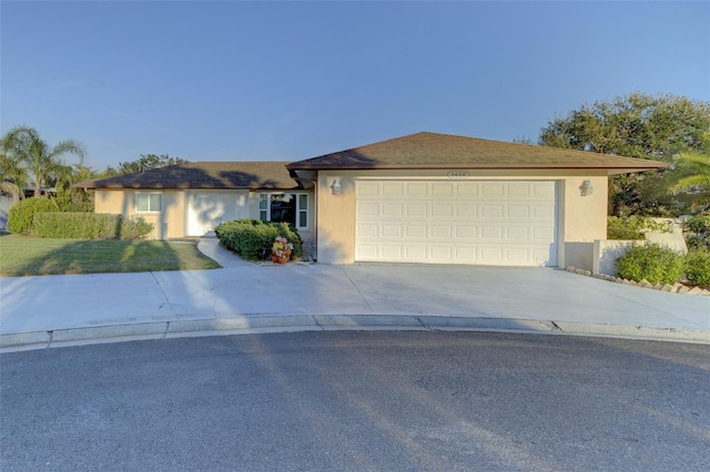 ranch-style home featuring a garage