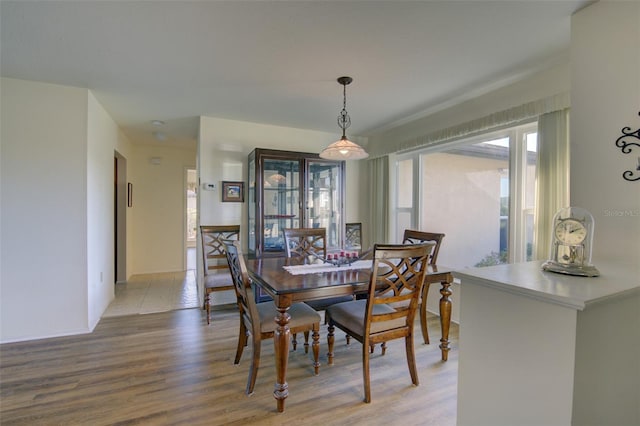 dining area with light wood-type flooring