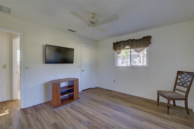 unfurnished room featuring ceiling fan and light hardwood / wood-style flooring