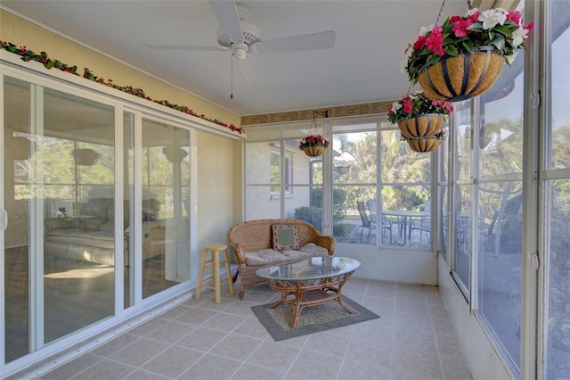 sunroom / solarium featuring ceiling fan