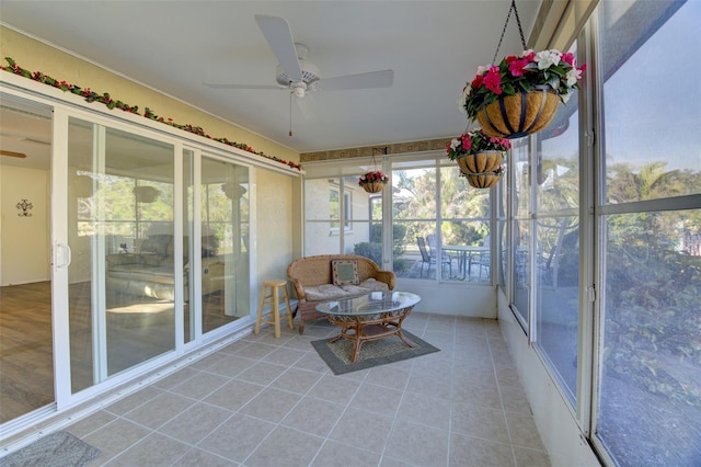 sunroom / solarium with plenty of natural light and ceiling fan