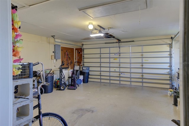 garage featuring a garage door opener and electric panel