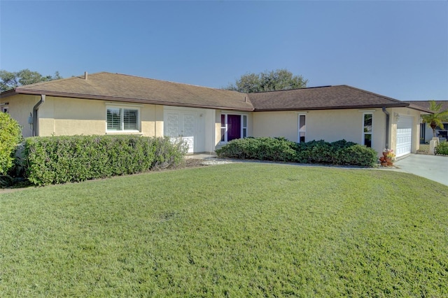 single story home with a garage and a front yard