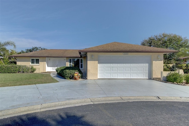 single story home with a garage