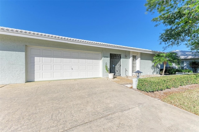 ranch-style home featuring a garage