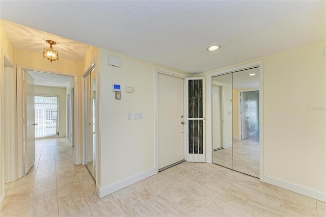 spare room with a textured ceiling