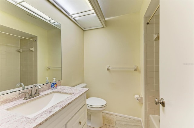 full bathroom featuring vanity, tiled shower / bath, tile patterned floors, and toilet