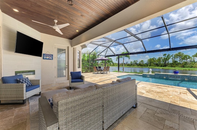 view of patio featuring a water view, pool water feature, an outdoor hangout area, and a lanai