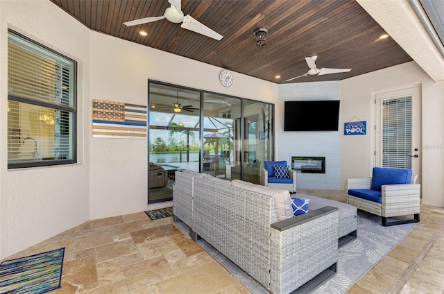 exterior space featuring wood ceiling and ceiling fan