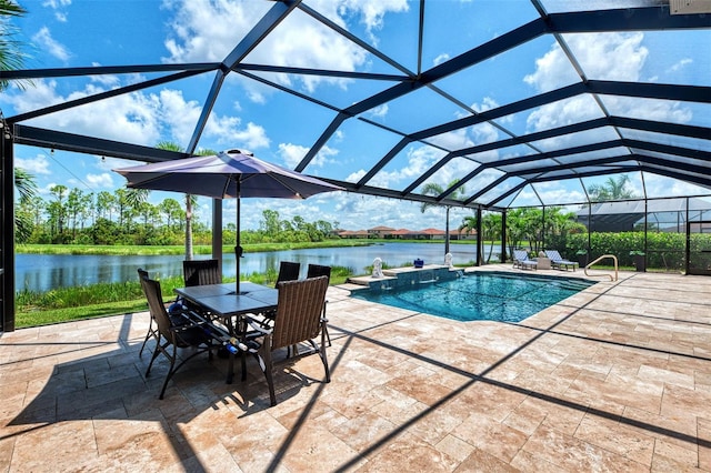 view of pool featuring a patio, a water view, and glass enclosure