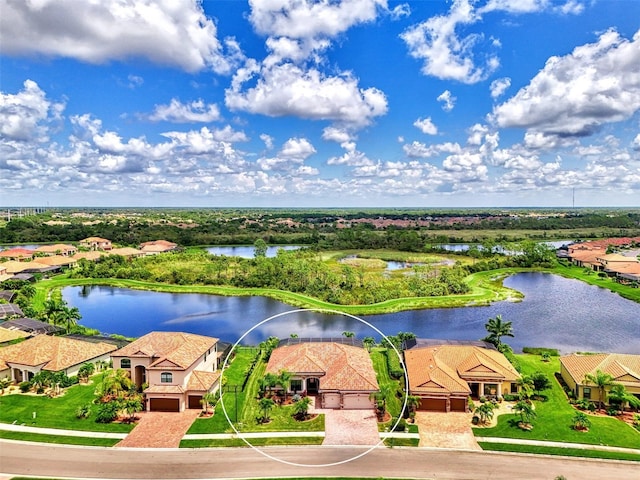 birds eye view of property with a water view