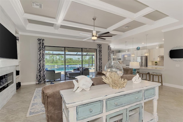 living room featuring crown molding, ceiling fan, and coffered ceiling