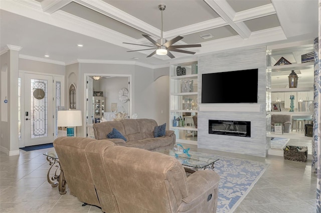 tiled living room featuring a fireplace, beamed ceiling, coffered ceiling, ceiling fan, and crown molding