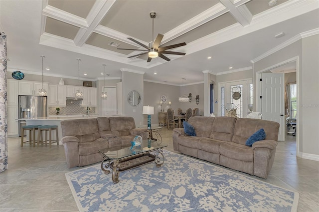 living room featuring coffered ceiling, ornamental molding, beamed ceiling, ceiling fan, and decorative columns